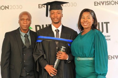 Lebogang at graduation with his parents.