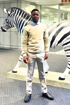 Lebogang standing in front of the iconic zebra at Investec Bank.