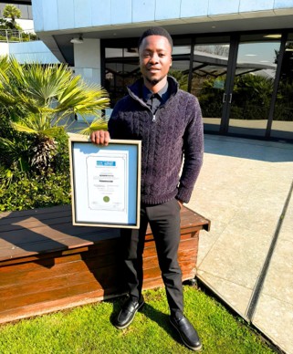 Lebogang with his professional designation certificate. 